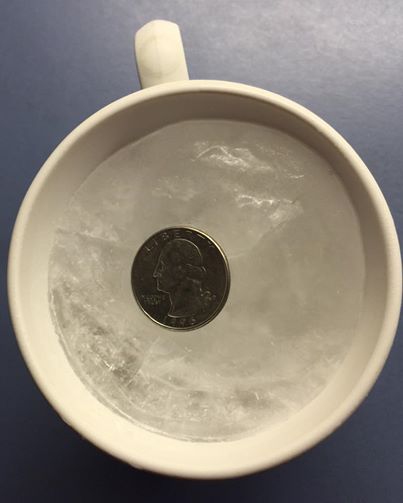 quarter-on-frozen-cup-of-water